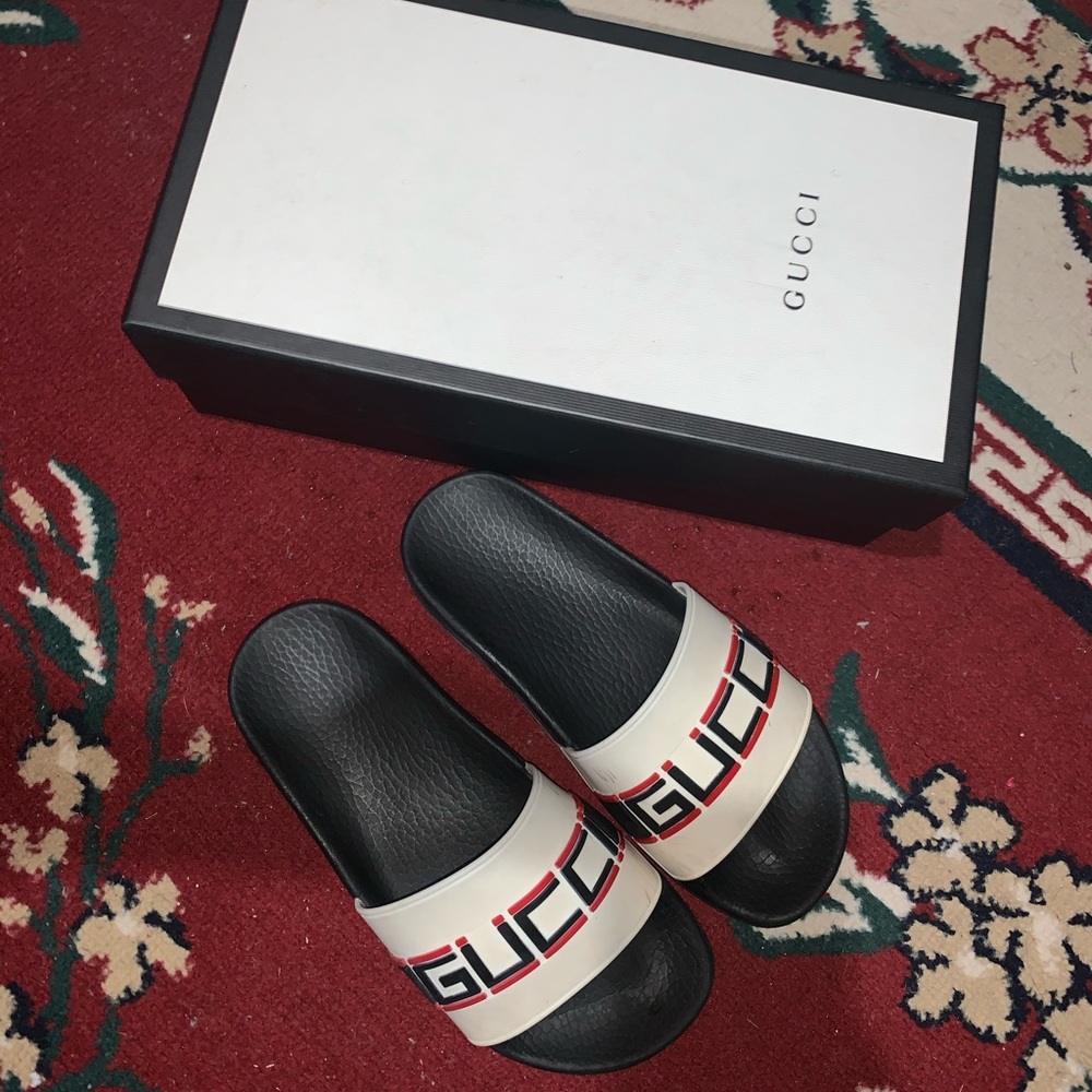 Gucci embossed logo slides